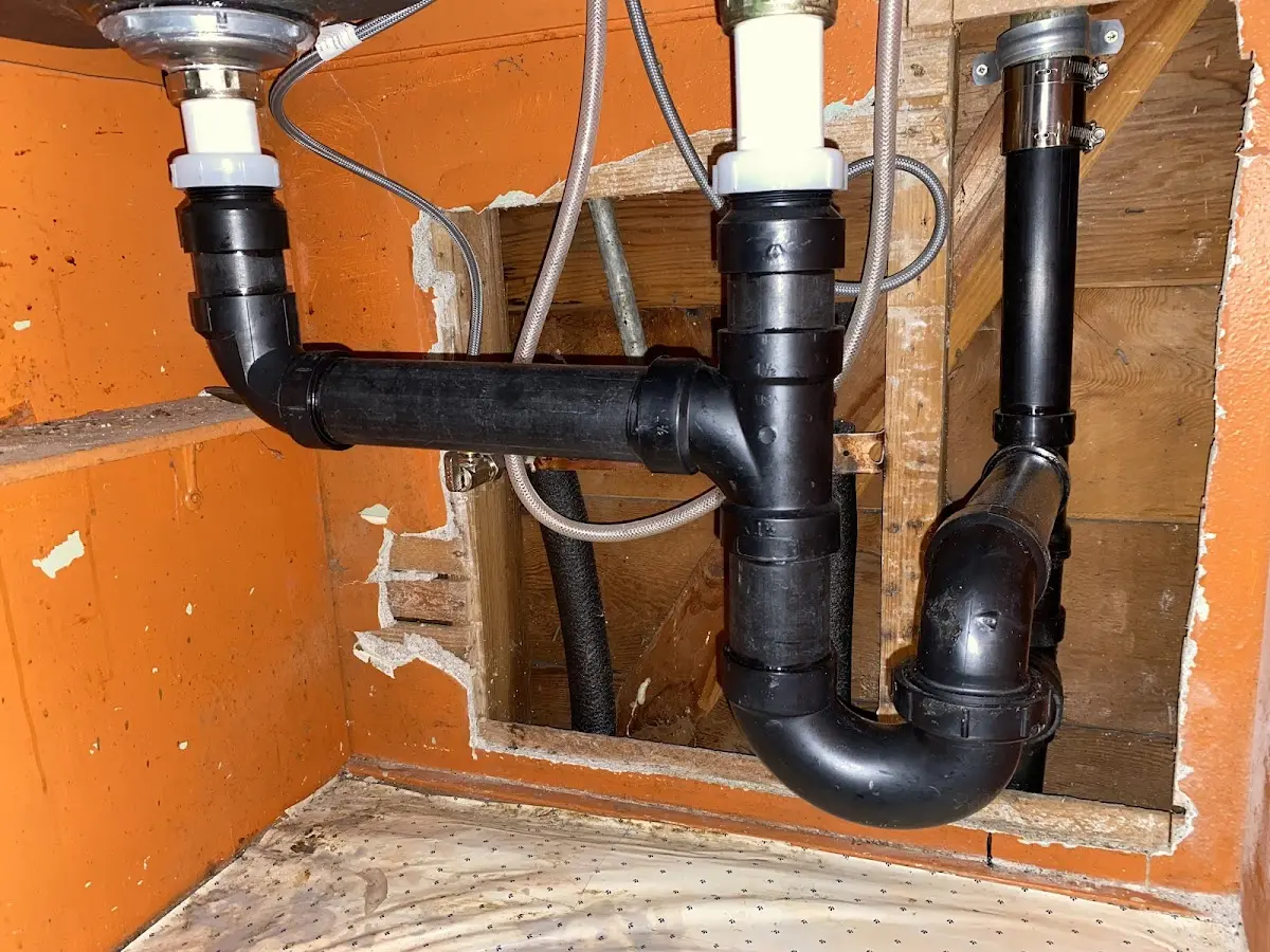 Professional Garbage Disposal Repair equipment and tools on the job in Evanston